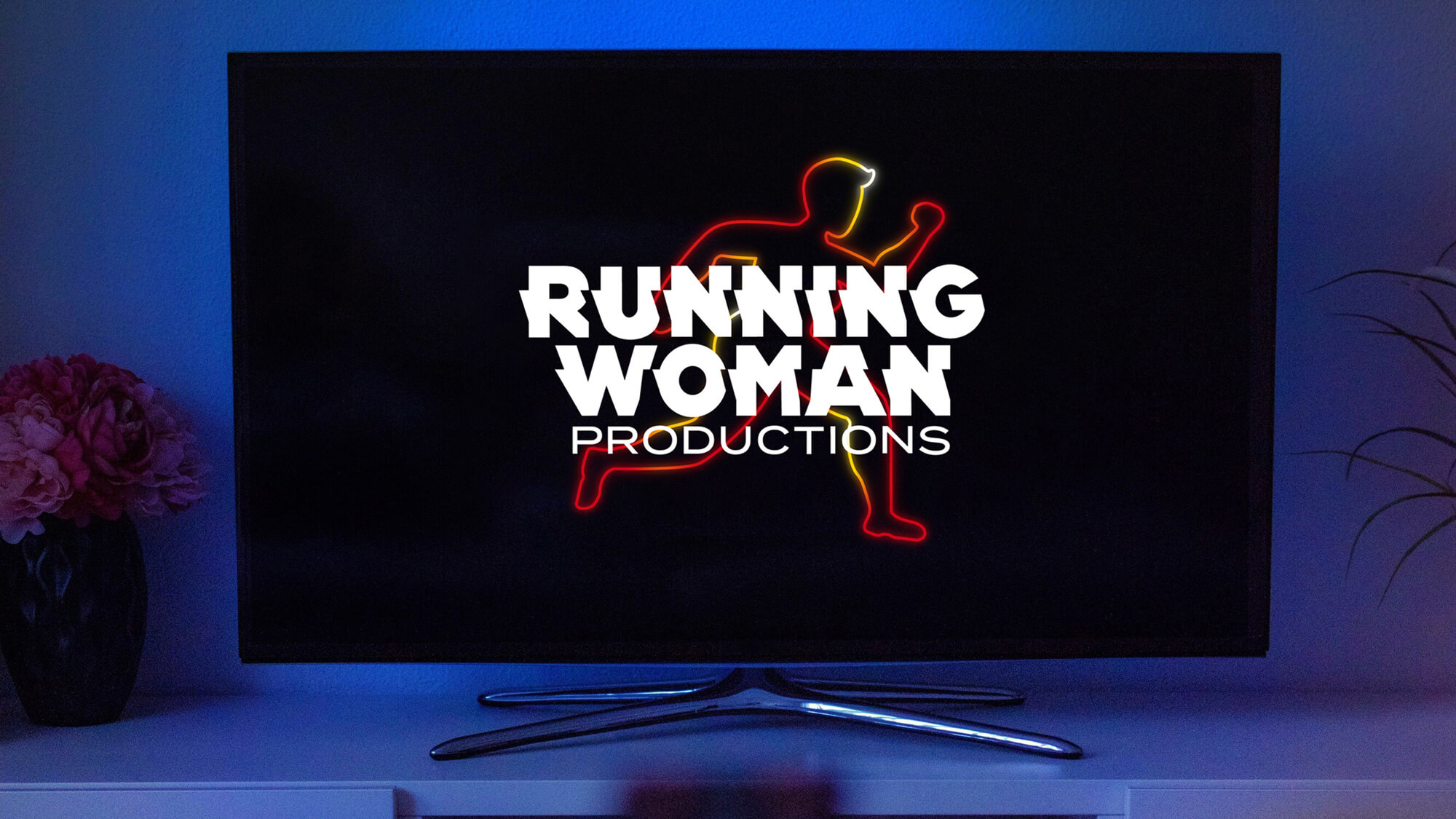 The Running Woman Logo on a flat screen TV